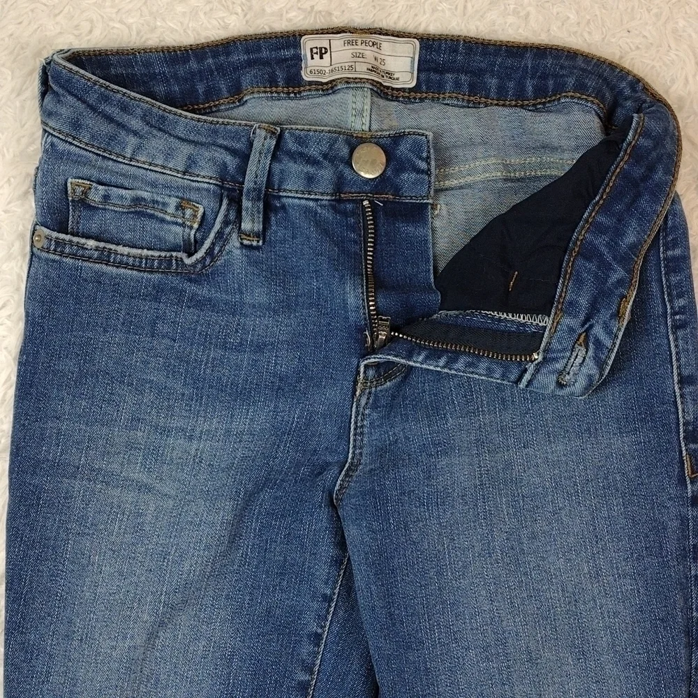 Free People Blue Medium Wash Five Pocket Mid Rise Raw Hem Cropped Boot Cut Jean